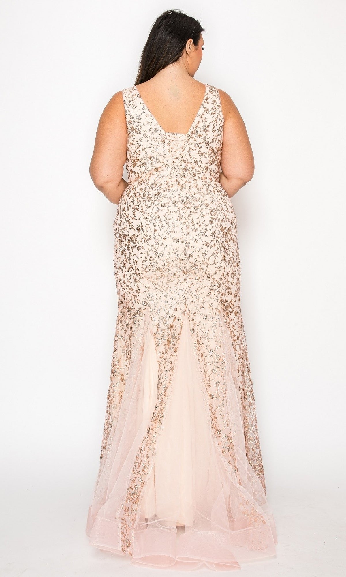 A woman in the Plus-Size Long Glitter Mermaid Prom Dress W1136 stands facing away from the camera, showing off its sleeveless, floor-length design and sparkling sequin details against a plain white background.